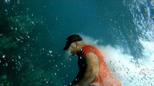 Man swimming in sea