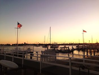 Scenic view of river against clear sky during sunset