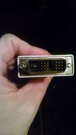Close-up of cropped hand holding camera