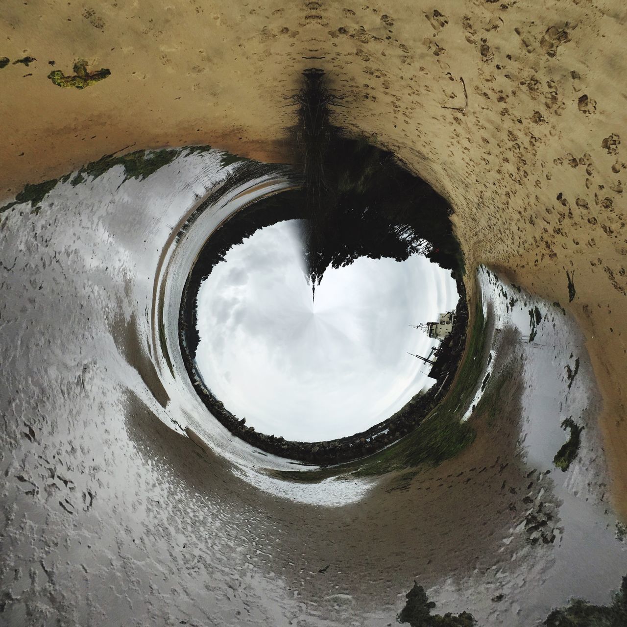 water, architecture, built structure, sky, puddle, cloud - sky, reflection, building exterior, cloudy, high angle view, wet, nature, day, no people, arch, outdoors, beach, weather, cloud