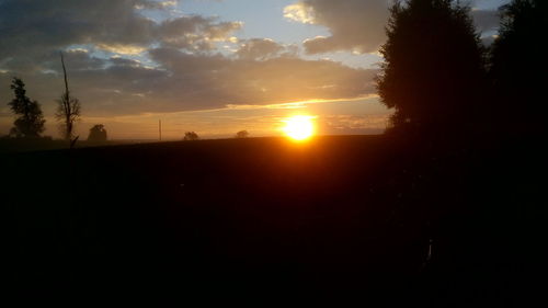 Scenic view of landscape against sky during sunset