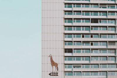 Low angle view of modern office building against sky