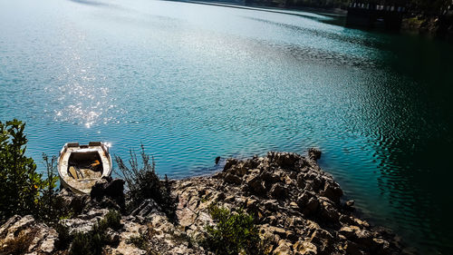 High angle view of rocks by lake