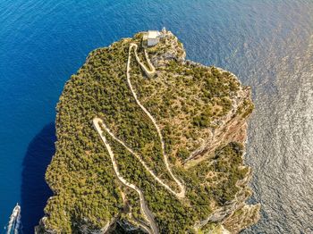 High angle view of rocks by sea