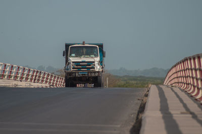 Empty road against clear sky