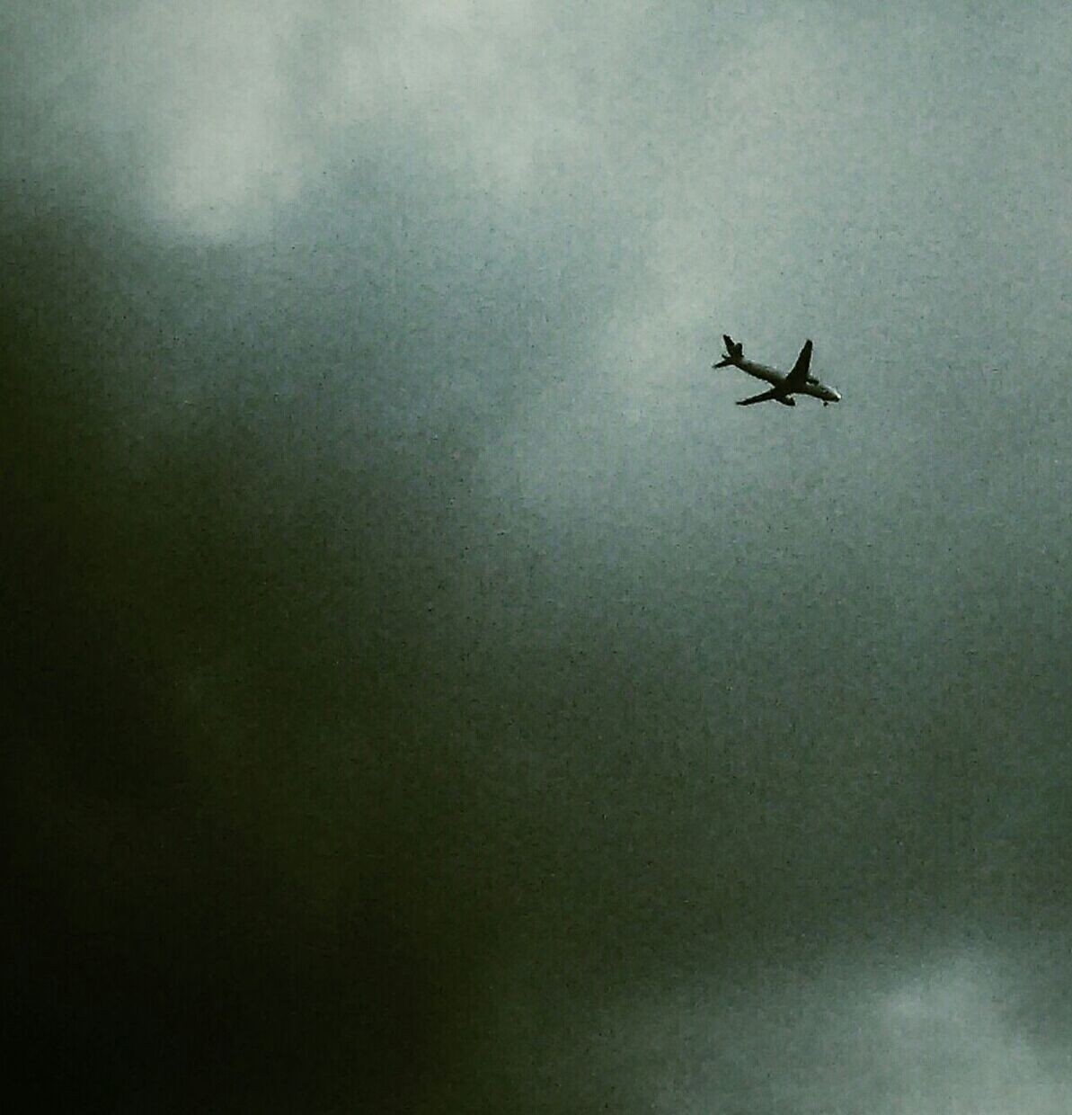 airplane, air vehicle, flying, mode of transport, transportation, sky, mid-air, low angle view, cloud - sky, aircraft wing, journey, on the move, travel, public transportation, nature, cloudy, aircraft, outdoors, weather, day