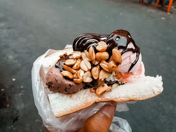 Close-up of hand holding ice cream