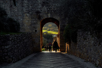 People walking in tunnel