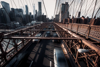 Bridge in city against sky