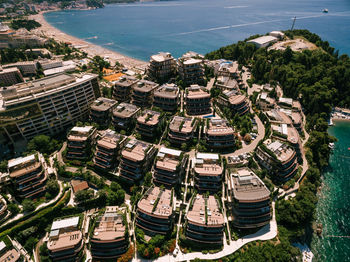 High angle view of buildings and sea in city