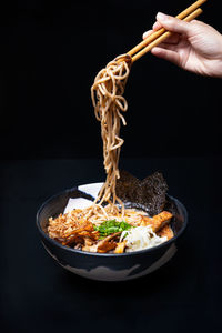 Cropped hand of person preparing food