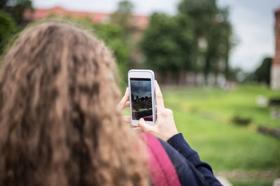 Man photographing with mobile phone