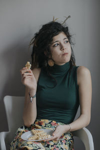 Young woman eating food