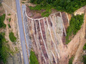 High angle view of dam on road by trees