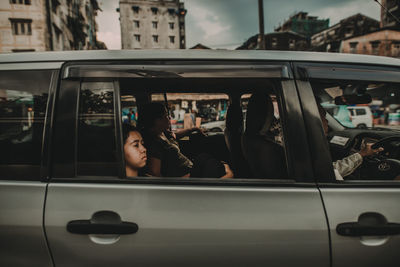 Woman sitting in car