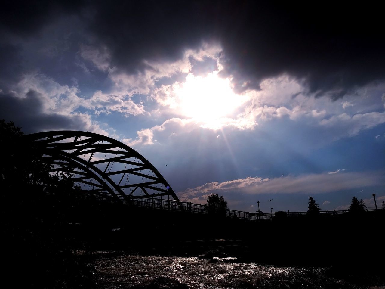 SILHOUETTE BRIDGE AGAINST SKY DURING SUNSET