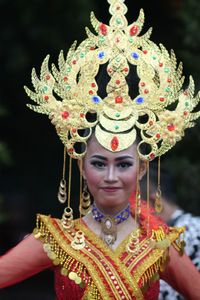 Portrait of young woman wearing headdress during festival