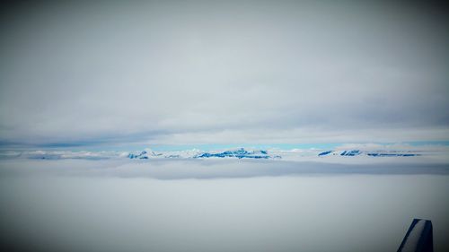 Scenic view of frozen lake against sky