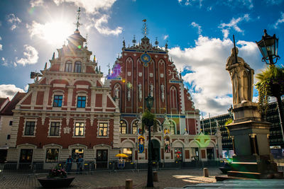 Buildings in city against sky