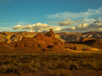 Scenic view of mountain against cloudy sky