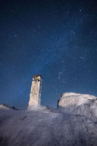 Low angle view of building against sky at night