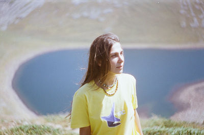 Portrait of woman standing on field