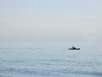 Kayaking fisherman alone on the ocean