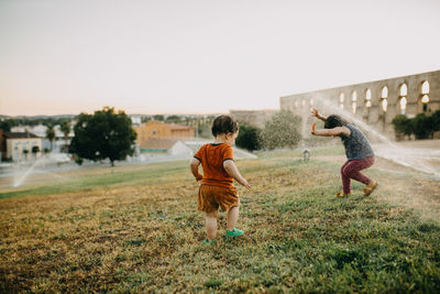 Full length of man on field against clear sky