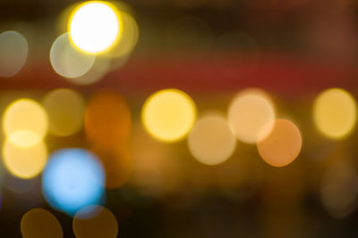 Defocused image of illuminated lights at night