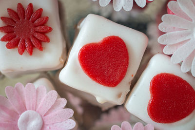 Close-up of colorful petit fours with flower decoration