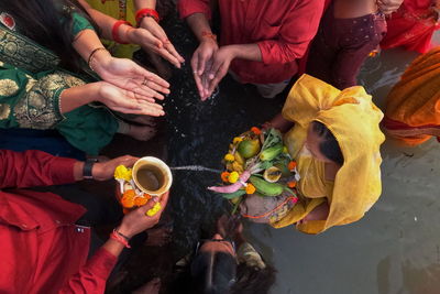 Colors of rituals. people are doing their rituals during chhath puja festival in kolkata, india.