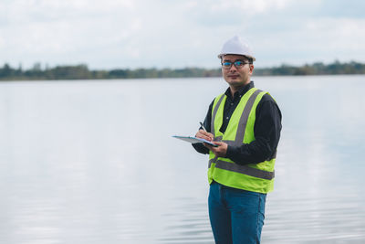 Portrait of man standing in lake