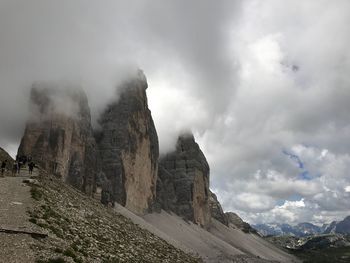Scenic view of mountains against cloudy sky