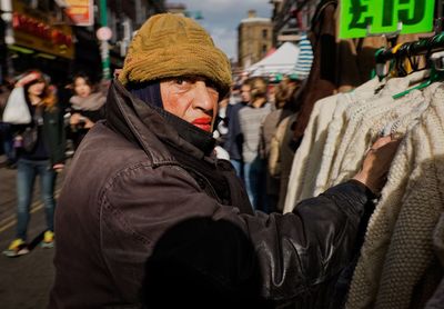 Portrait of man on street in city during winter