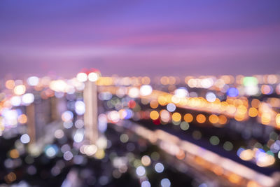 Defocused image of illuminated lights at night