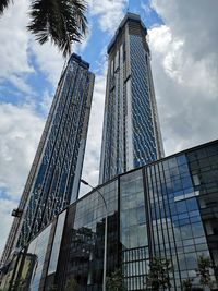 Low angle view of modern buildings against sky