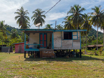 House on field against sky