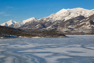 Typical winter landscape in abruzzo mountains with frozen lake