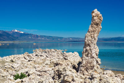 Scenic view of sea against clear blue sky