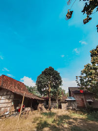 Low angle view of buildings against blue sky