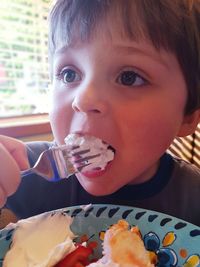 Portrait of boy eating ice cream