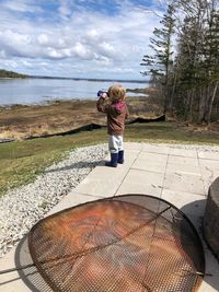 High angle view of toddler with binoculars 