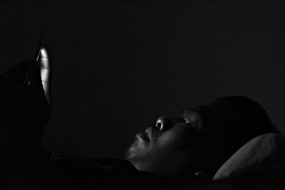 Portrait of man sleeping on bed