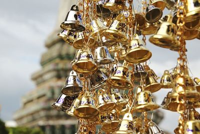 Close-up of hanging golden bells