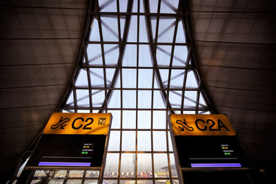 Low angle view of illuminated sign at the airport