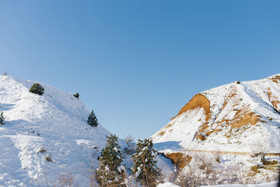 Mountain peaks of the tien shan covered with snow. beldersay resort in winter on a clear sunny day