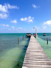 View of pier over calm blue sea