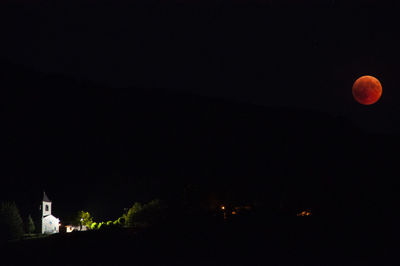 View of illuminated building against clear sky at night