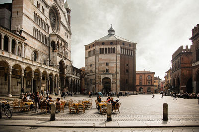 Sidewalk cafe against cremona baptistery