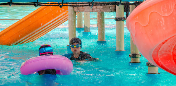 Portrait of man swimming in pool